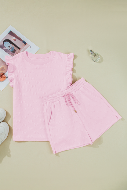 Pink textured top and shorts set laid flat