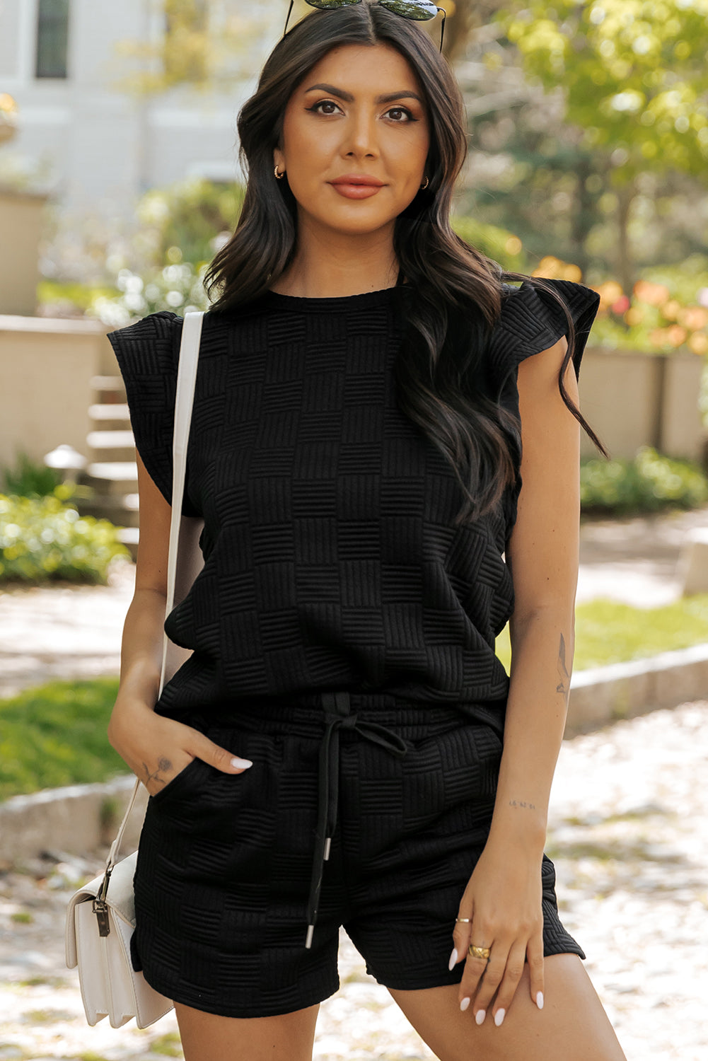 Black waffle knit ruffle sleeve tee and drawstring shorts, front view