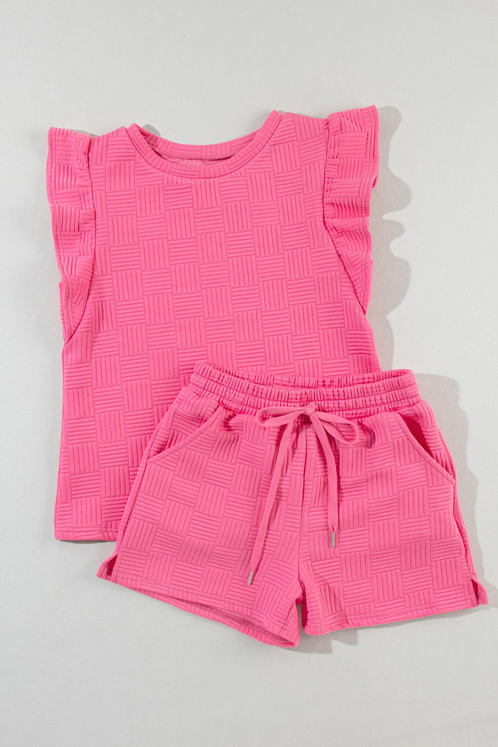 Pink waffle knit ruffle sleeve tee and shorts laid flat